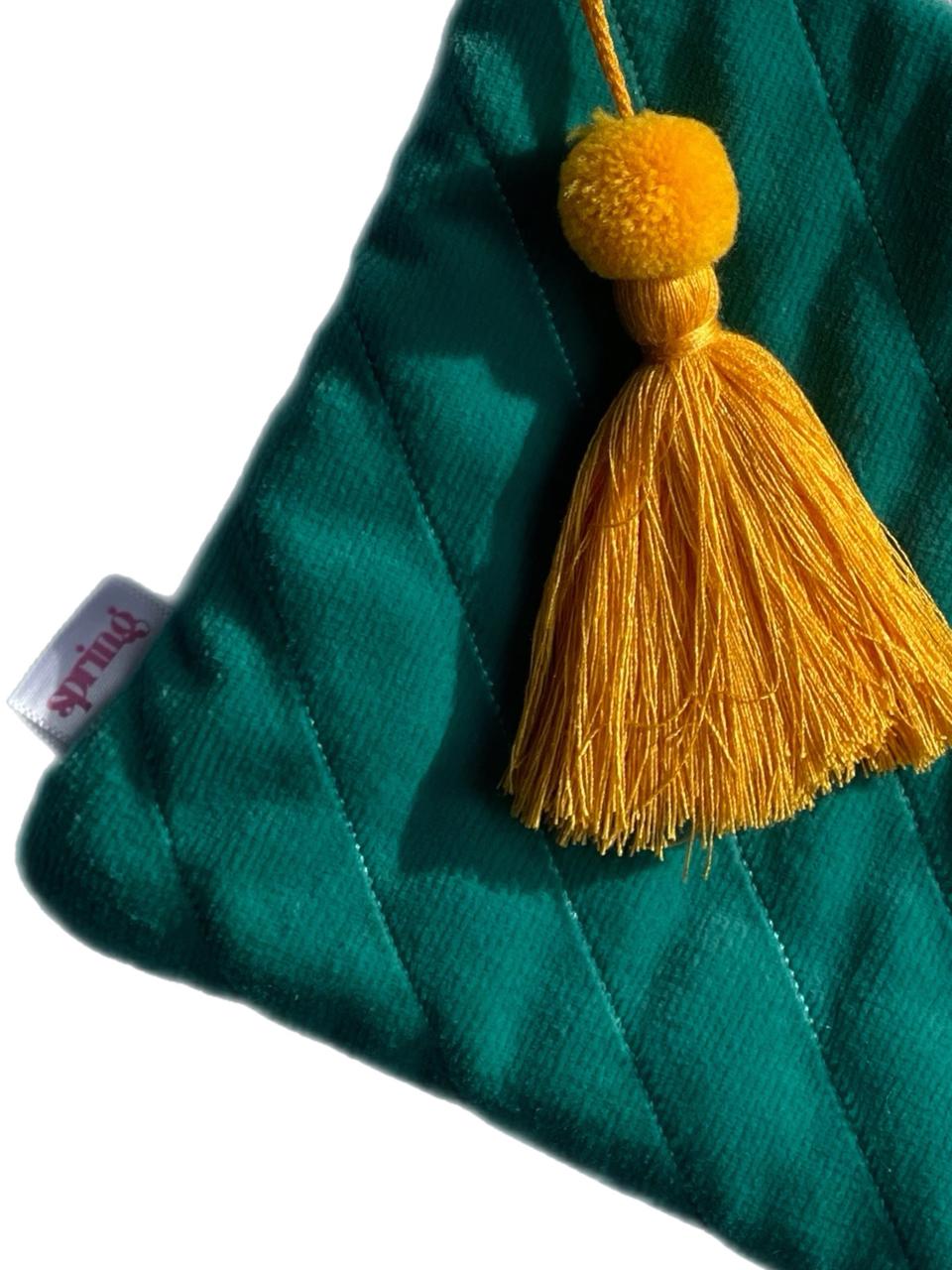 turquoise clutch with yellow tassel